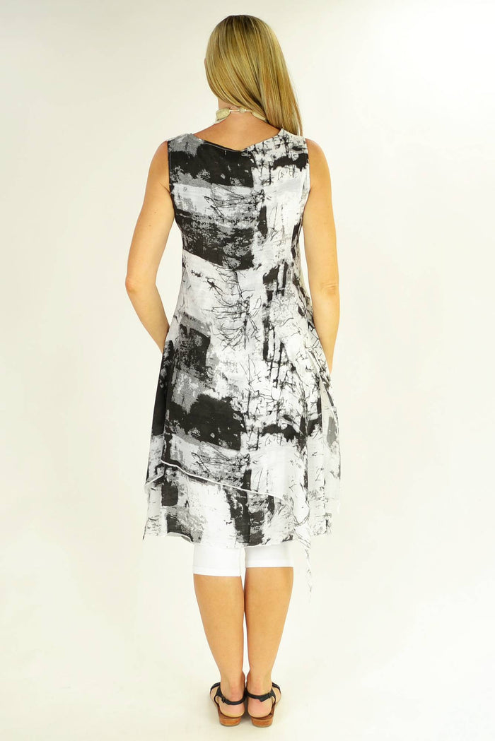 Black Mandy tunic by whispers displayed on a hanger, featuring a relaxed fit and simple neckline, ideal for casual wear.