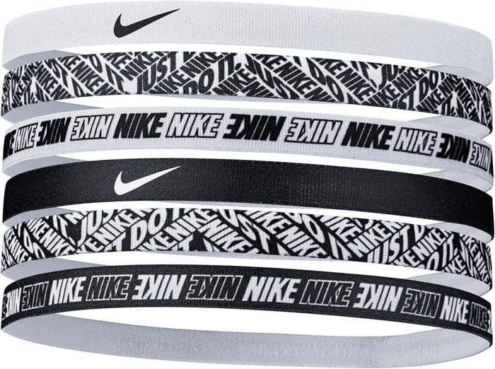 Six Nike printed white hair headbands in a pack, designed for sports and active wear, featuring stylish patterns.
