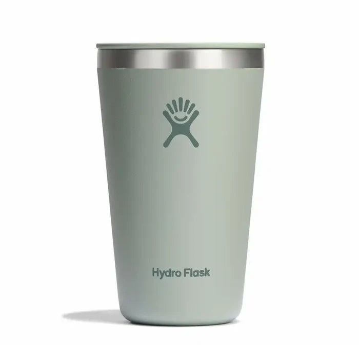 A Hydro Flask travel tumbler in a muted sage green color with a stainless steel rim and the classic Hydro Flask logo on the front