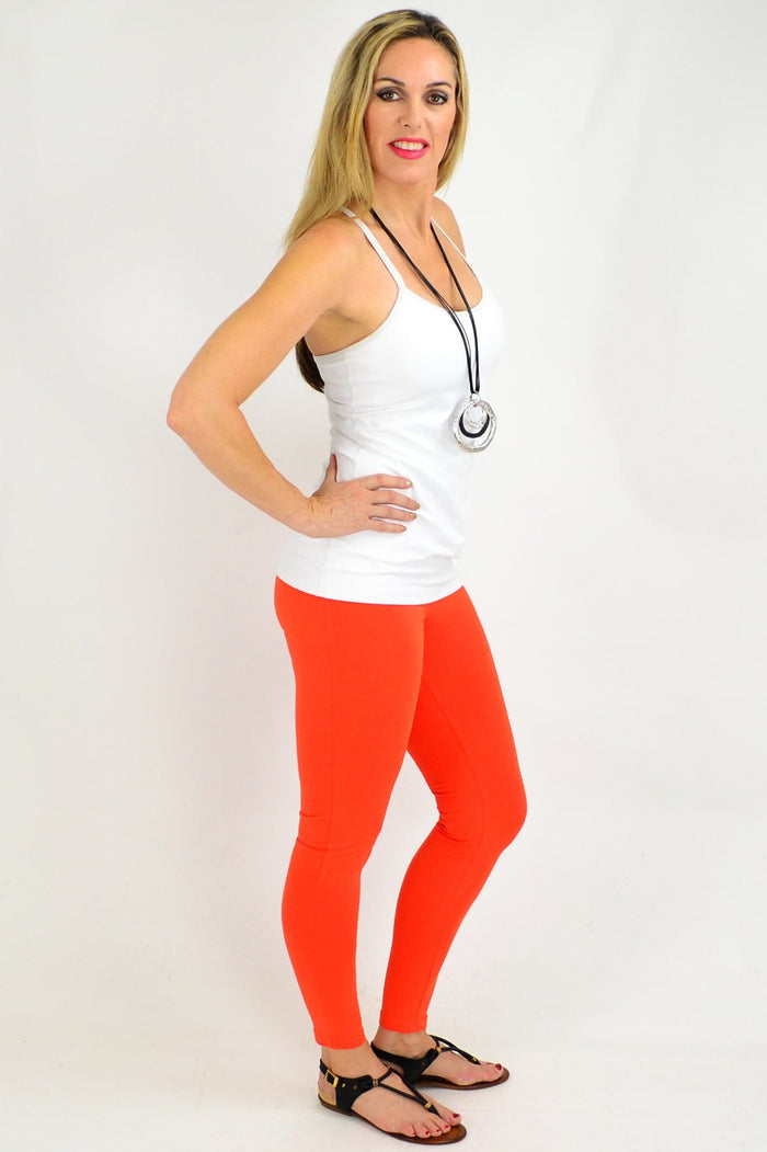 Orange ankle-length leggings by David Jessie, shown laid flat with elastic waistband and vibrant color details.