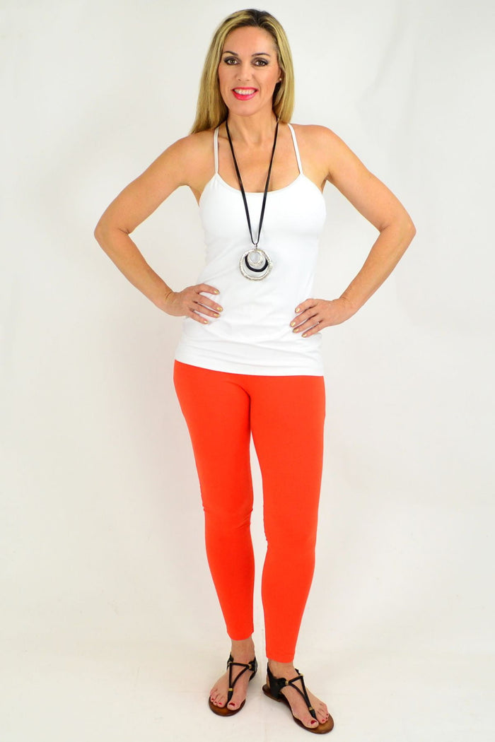 Orange ankle length leggings by David Jessie featuring a snug fit and comfortable stretch, displayed on a neutral background.