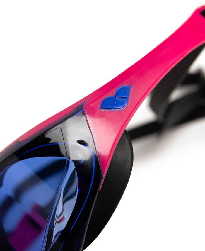Arena Cobra Edge Swipe racing goggles in blue, violet, pink, and black with a sleek, aerodynamic design for competitive swimming.