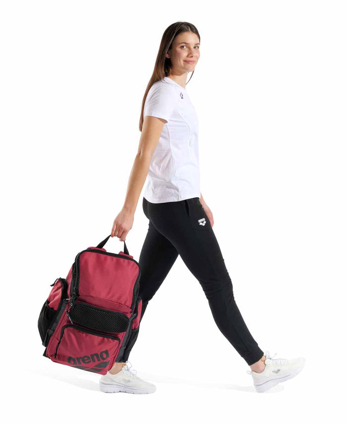 Arena One Go Backpack 45L in crimson, showing the durable nylon fabric, adjustable shoulder straps, and multiple compartments.