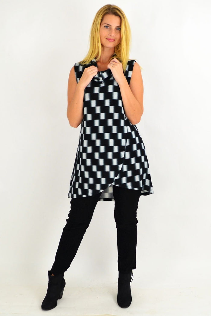 Black check fold-over front tunic top by Whispers featuring long sleeves and a relaxed fit, displayed on a white background.