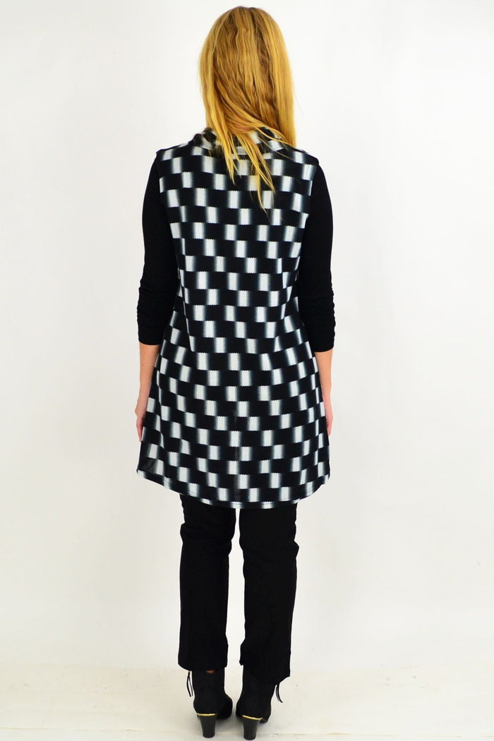 Black check fold-over front tunic top by Whispers featuring long sleeves and a relaxed fit, perfect for casual wear.