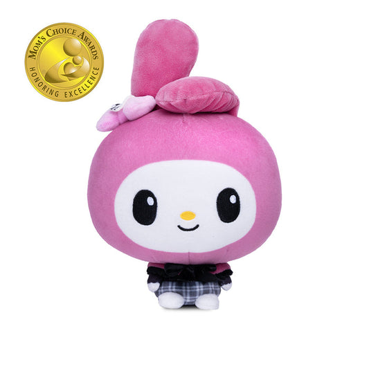 A pink My Melody plushie with a white face, black eyes, a small yellow nose, and a black-and-white plaid skirt, shown on a plain white background. A gold Mom's Choice Awards badge appears in the top-left corner.