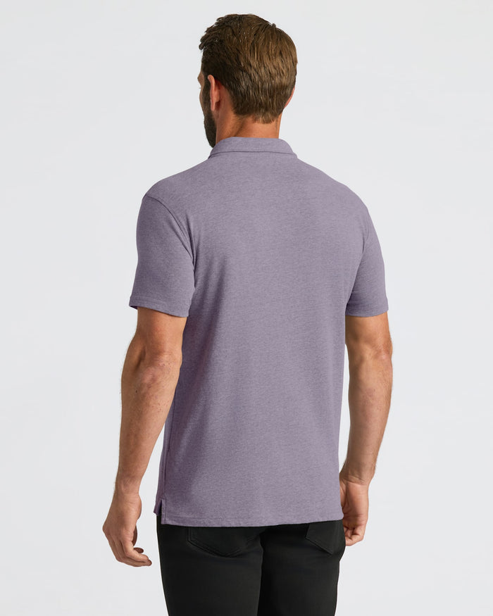 Back view of man in Dark Heather Amethyst Short Sleeve Polo.