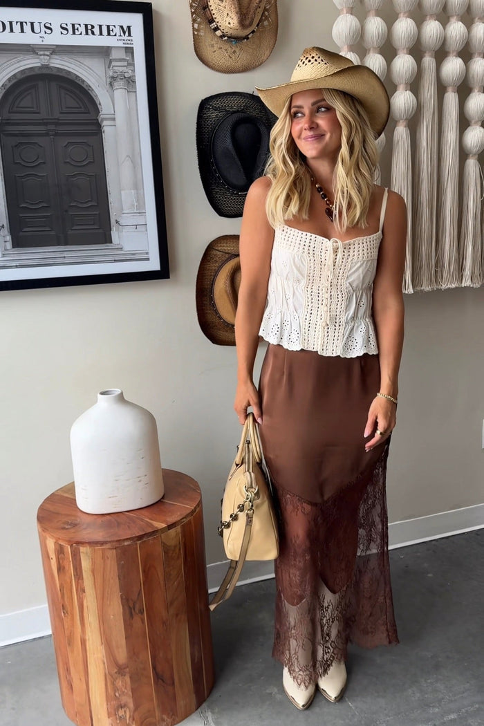 Brown satin midi skirt with sheer lace panels at the hem