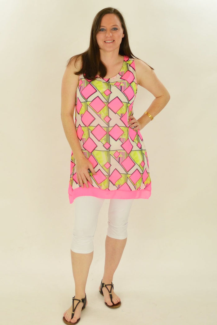 Pink squares pattern tunic by Whispers, featuring a relaxed fit and vibrant geometric design, displayed on a hanger.