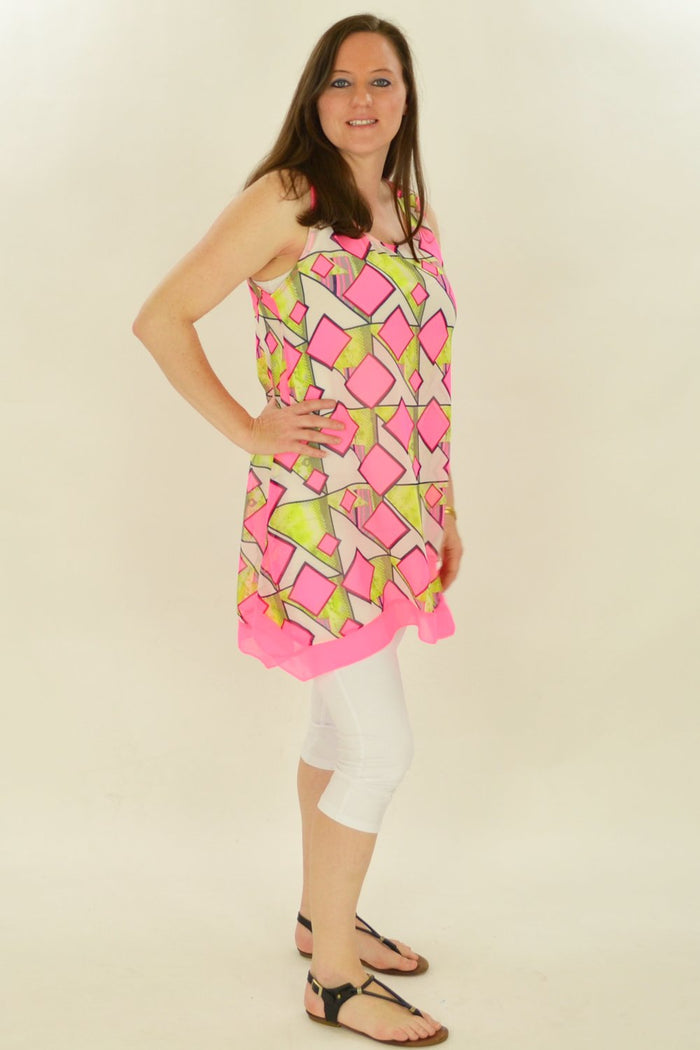 Pink squares pattern tunic by Whispers, showcasing a stylish, comfortable women's tunic with vibrant geometric design.