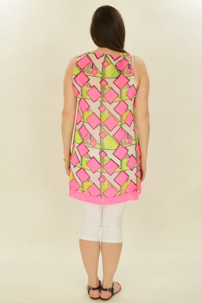 Pink squares pattern tunic by Whispers, lightweight fabric with a relaxed fit, shown hanging on a wooden hanger.