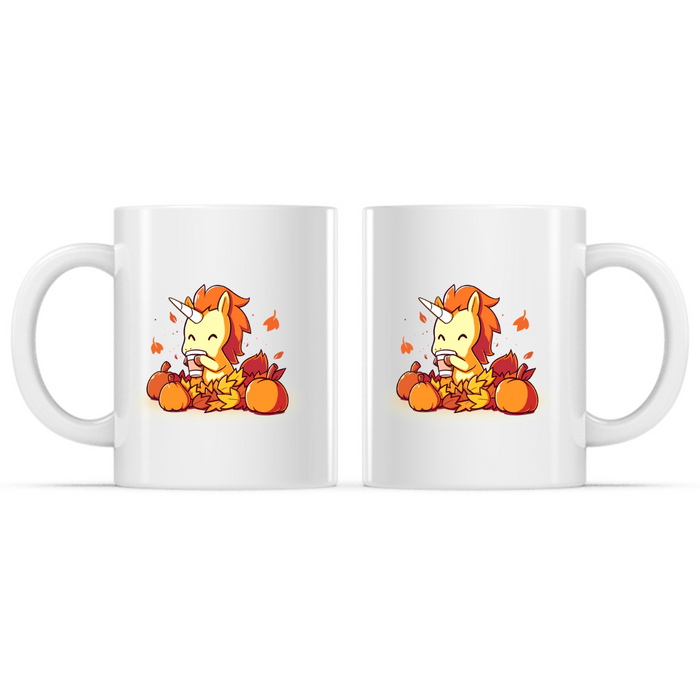Ceramic Mug_TeeTurtle Pumpkin Spice Unicorn white mug featuring a smiling unicorn enjoying a warm pumpkin spice drink while sitting among pumpkins and colorful autumn leaves with leaves drifting through the air.