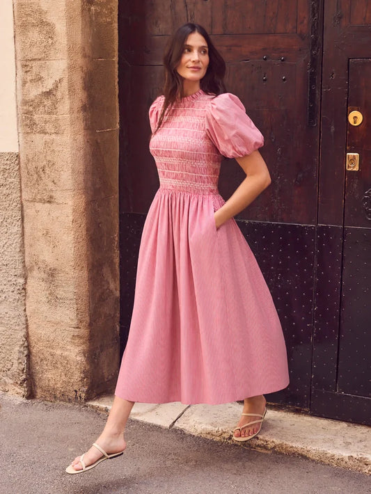 Red stripe midi dress with shirred bodice, puff sleeves, frill neckline and flowing skirt.