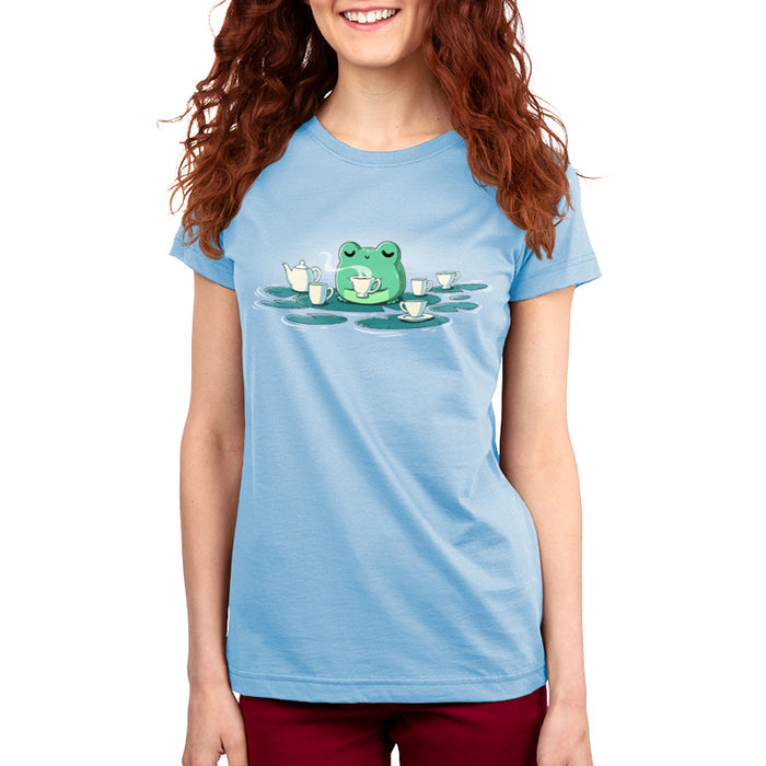 Premium Cotton T-shirt_TeeTurtle light blue Ribbit and Sip apparel featuring a frog drinking coffee sitting on a lily pad surrounded by lily pads with coffee cups on them.
