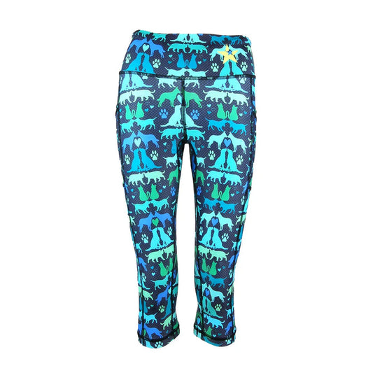 Capri-length leggings with colorful dog and paw print pattern on dark blue background