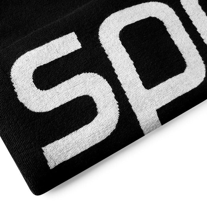 Black and white Speedo logo towel featuring a soft, absorbent fabric with prominent Speedo branding for swimming and beach use.
