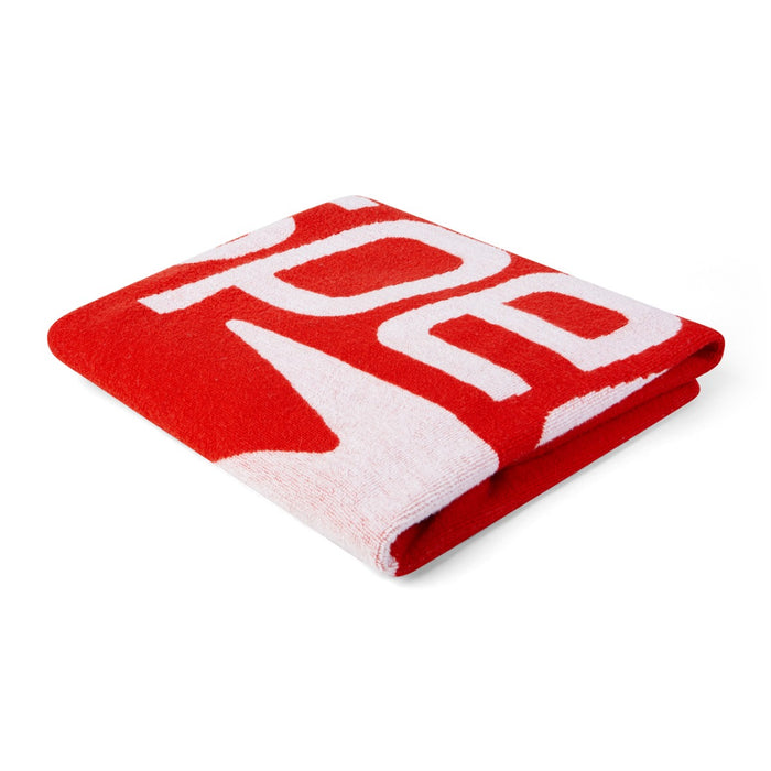 Red and white Speedo logo towel with bold branding, soft fabric, perfect for swimming and beach use.