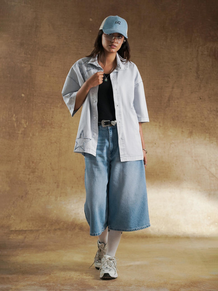 Frayed raw edge star detail on washed denim - GROOVY Pakistan