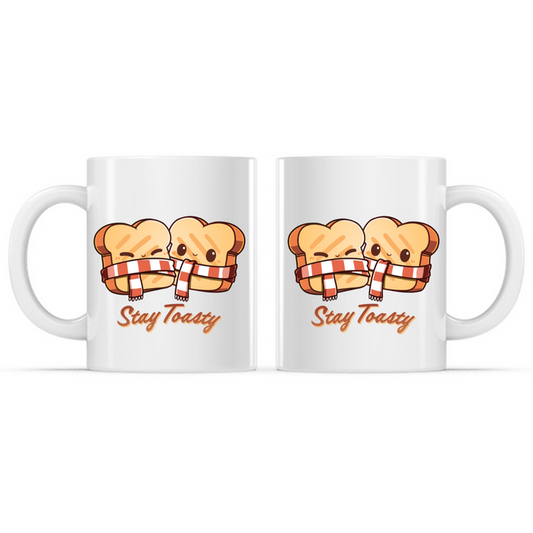 Ceramic Mug_TeeTurtle Stay Toasty Mug white mug featuring two smiling slices of toast wrapped together in a cozy striped scarf above the phrase "Stay Toasty."