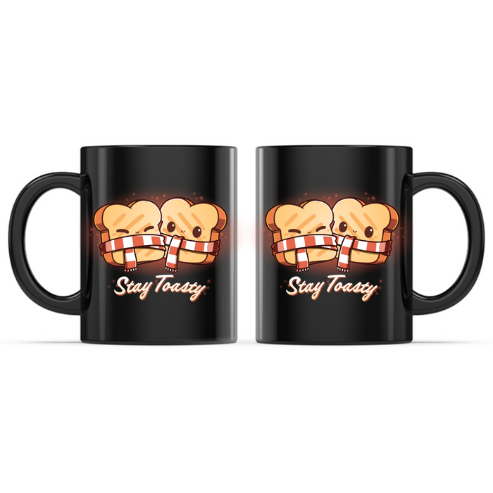 Ceramic Mug_TeeTurtle Stay Toasty Mug black mug featuring two smiling slices of toast wrapped together in a cozy striped scarf above the phrase "Stay Toasty."