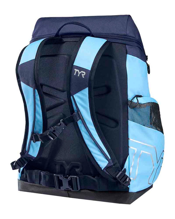 TYR Alliance 45L backpack in light blue and navy with multiple compartments and adjustable straps, designed for sports and travel.