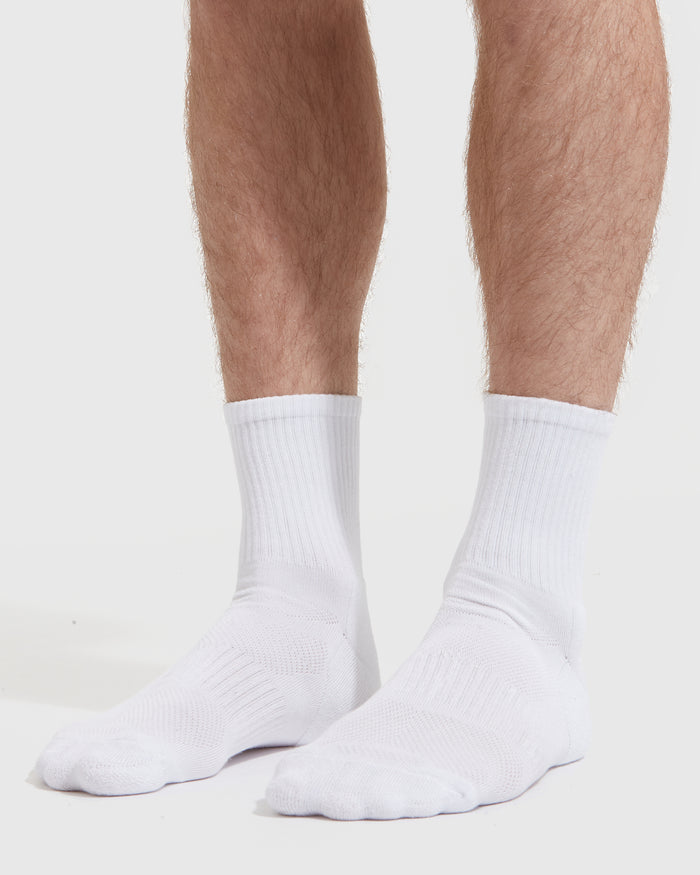 White Half Crew Socks 3-Pack showcased on male model's legs and feet.